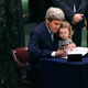 John Kerry and his two-year-old granddaughter sign the Paris Agreement on April 22, 2016. Image via Getty.